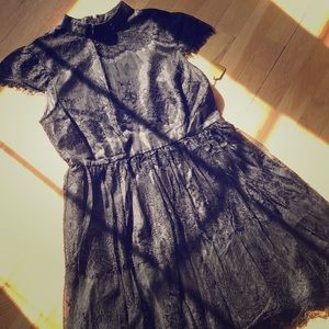 Black lace dress with cuffed sleeves